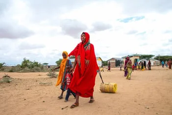 A family in Kenya carrying water provided by UNICEF